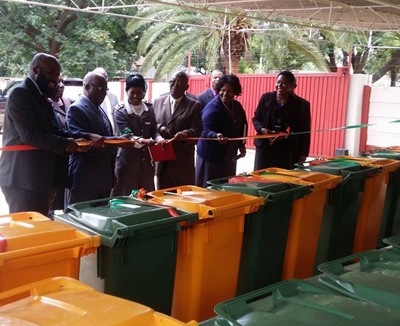 Representatives of the supported health institutions receiving the bins at a ceremony held at OPHID offices in Bulawayo